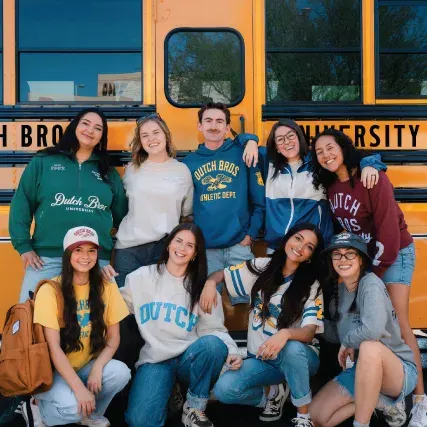 group of young people wearing dutch bros new back to cool collection merch