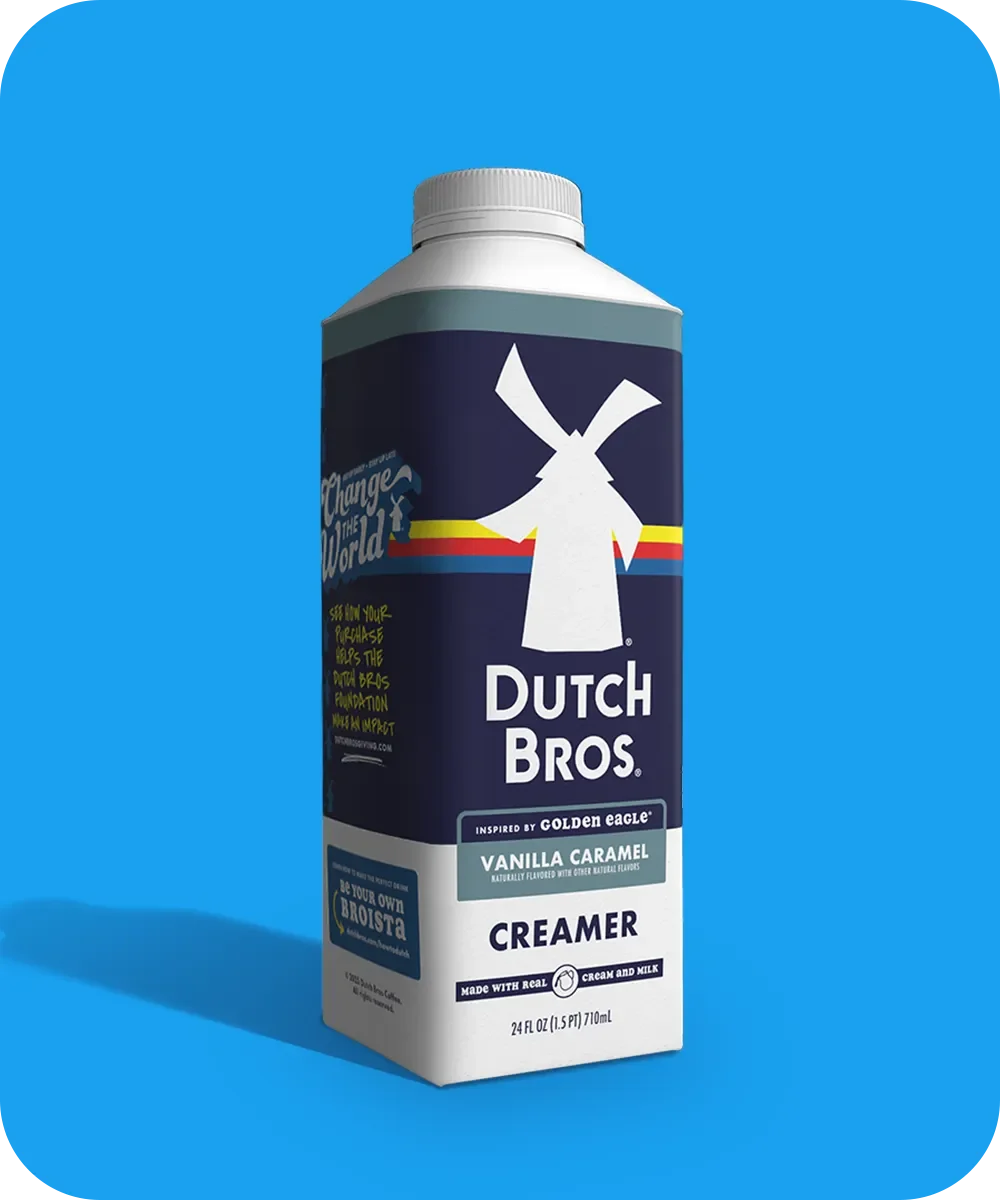 Dutch Bros Vanilla Caramel coffee creamer bottle with windmill logo on a bright blue background.