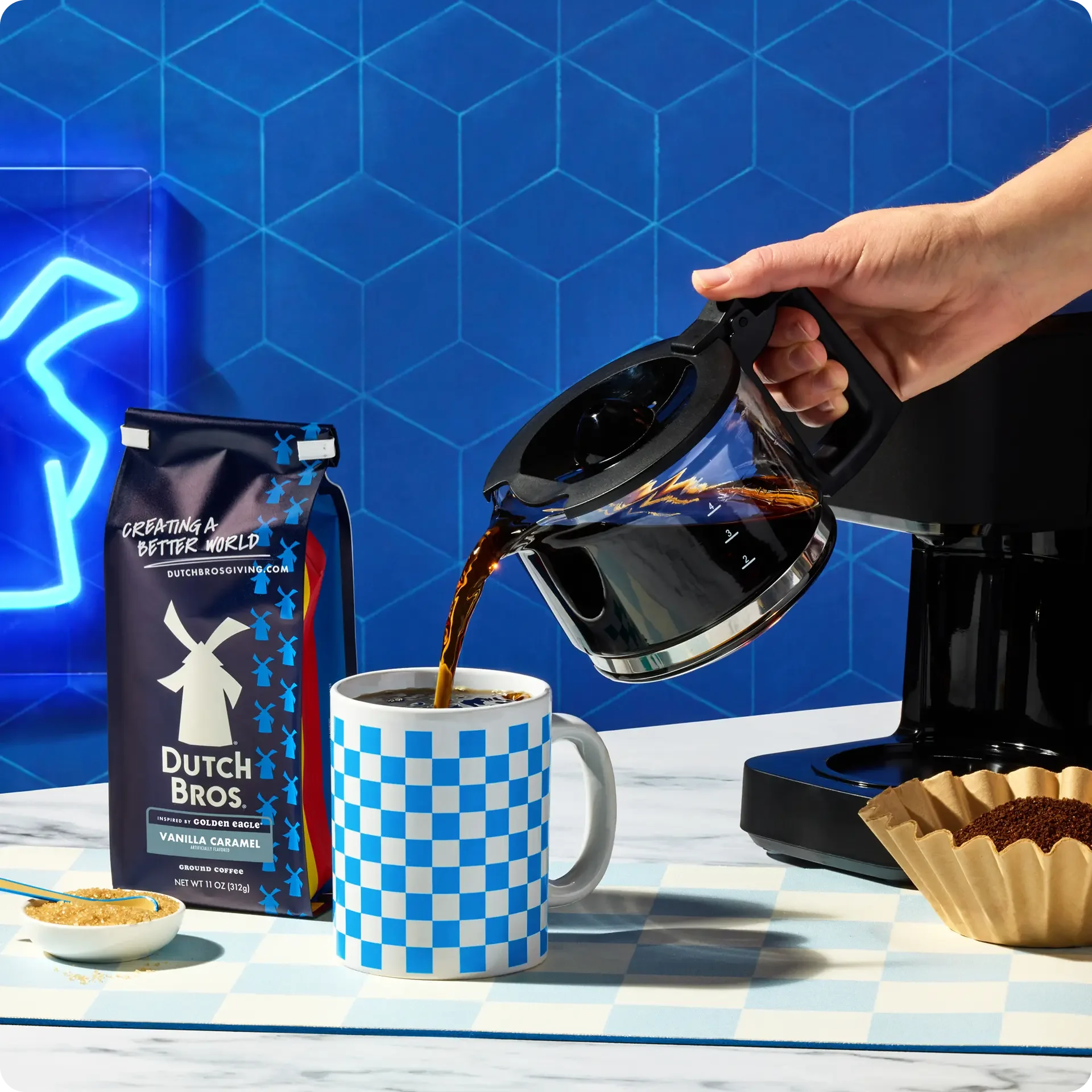 person pouring coffe into dutch bros coffee cup