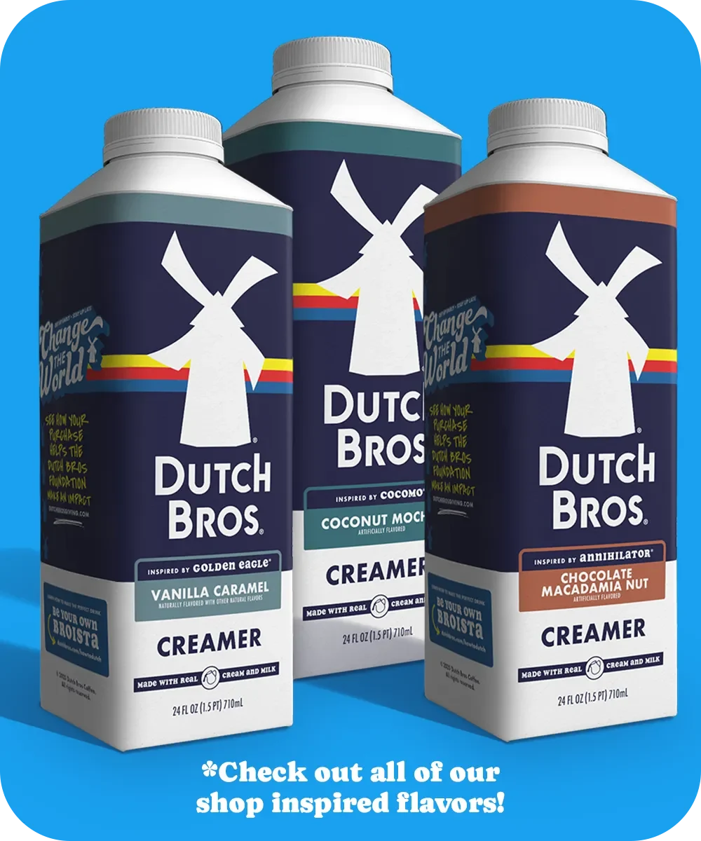 Three Dutch Bros coffee creamer containers in different flavors against a blue background with promotional text.
